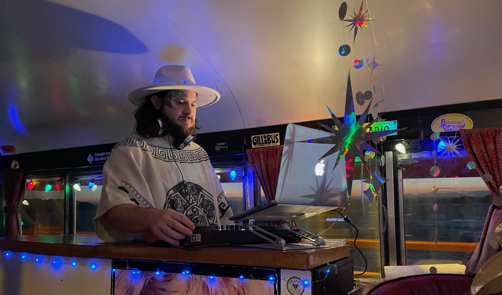 DJ NickNak performing inside the Gillibus at sunset